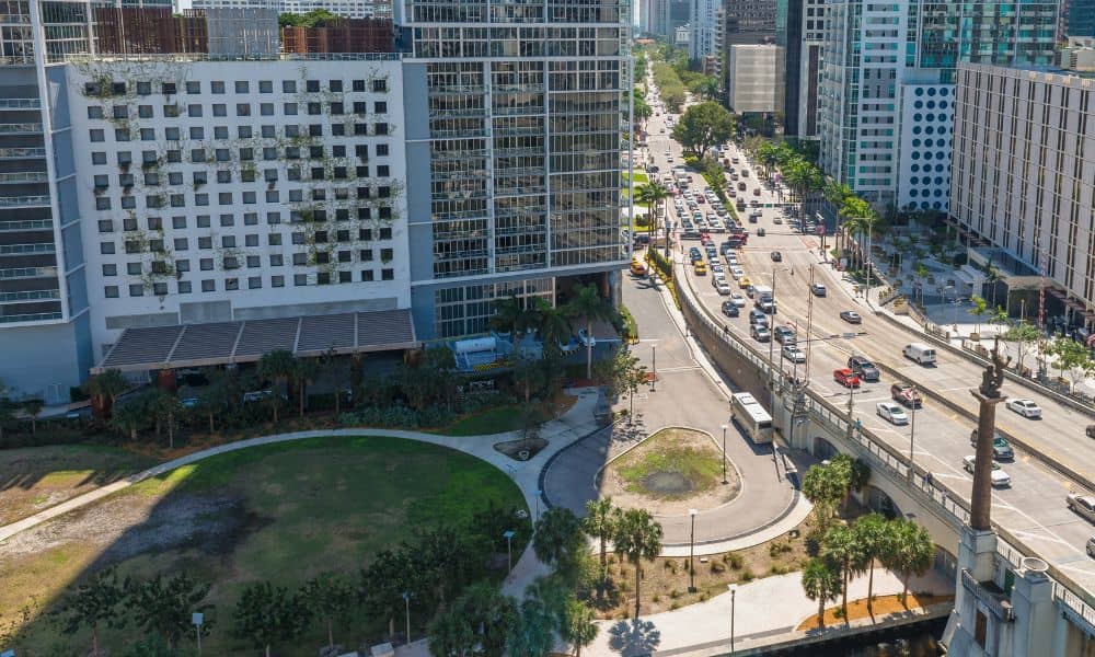 Alta title survey land transfer case - ALTA SURVEY Miami Aerial view of downtown high-rise buildings and roadways representing complex land ownership and the importance of an ALTA title survey.