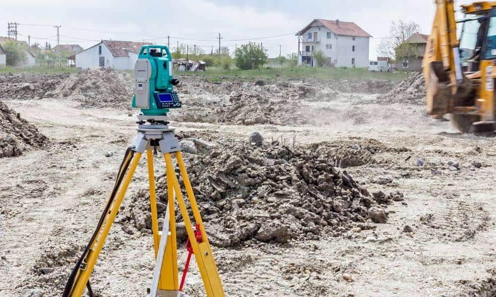 Land survey equipment set up at a residential development site as more owners search for land surveyors in my area