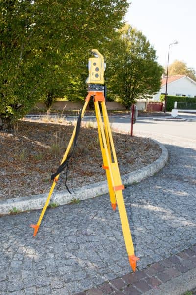 Surveying equipment (total station) used to measure elevation for an elevation certificate